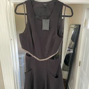 NBD black cut out dress with beading around the mid section.